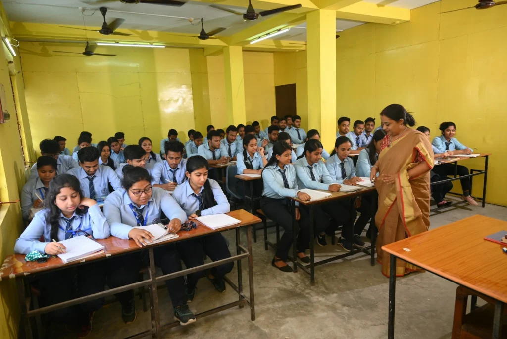 Students attentively studying in a classroom during a home tutoring session in Jalandhar.